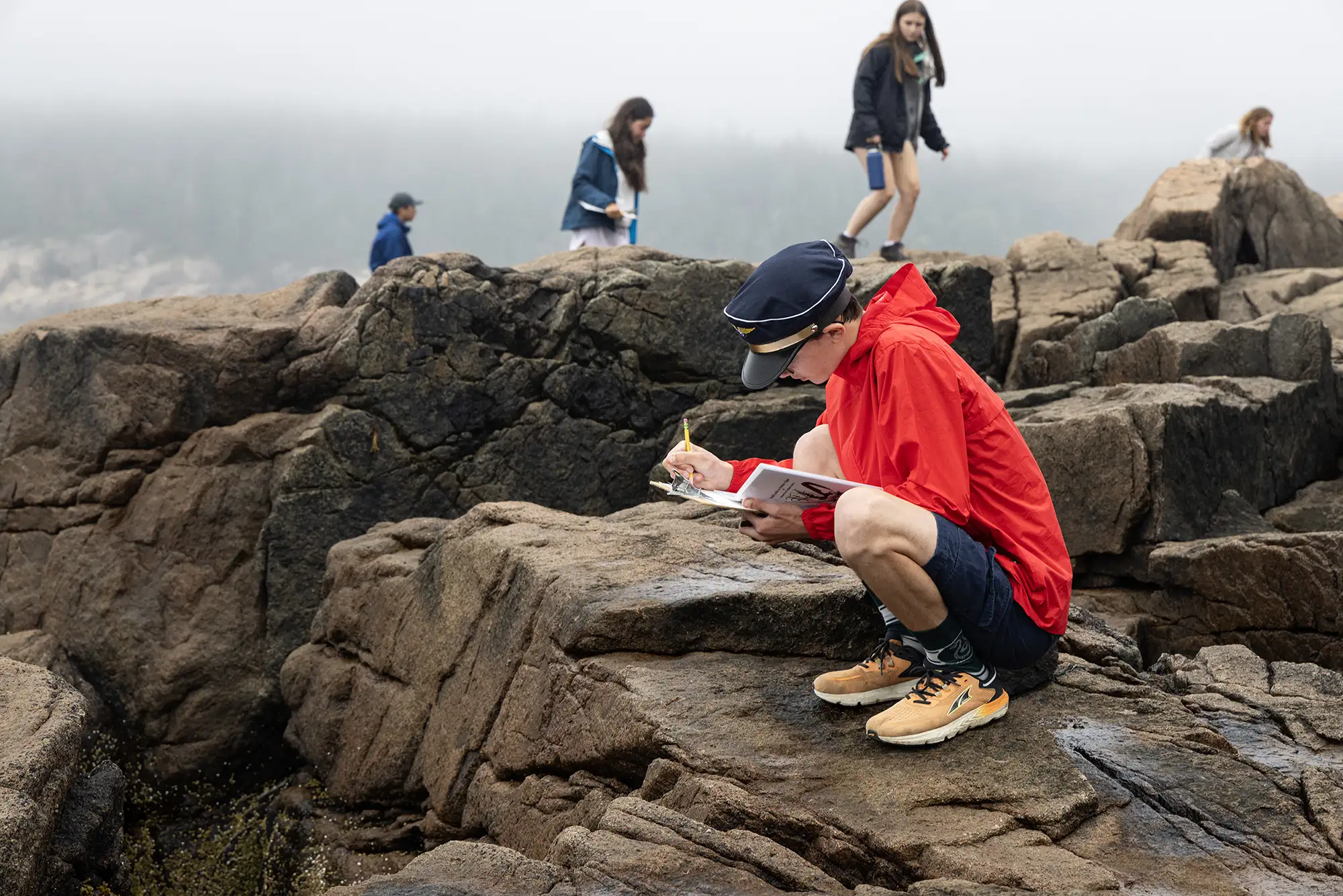 campers-walking-observing-rocks